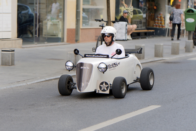 10 - Mini vehicle in a guided city tour experience featuring miniature white Hot Rod vehicles operating in Bucharest